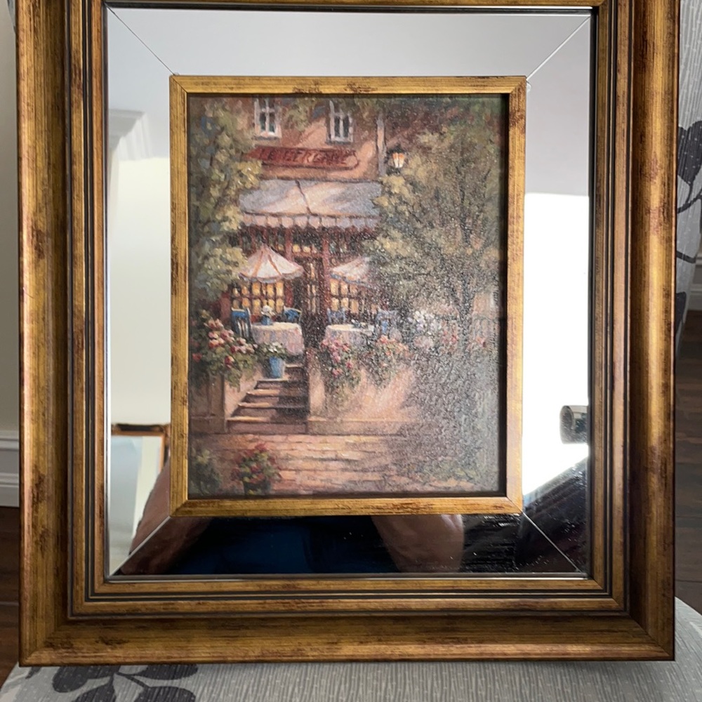 Scenic cafe print framed. Frame brown with mirror inlay.